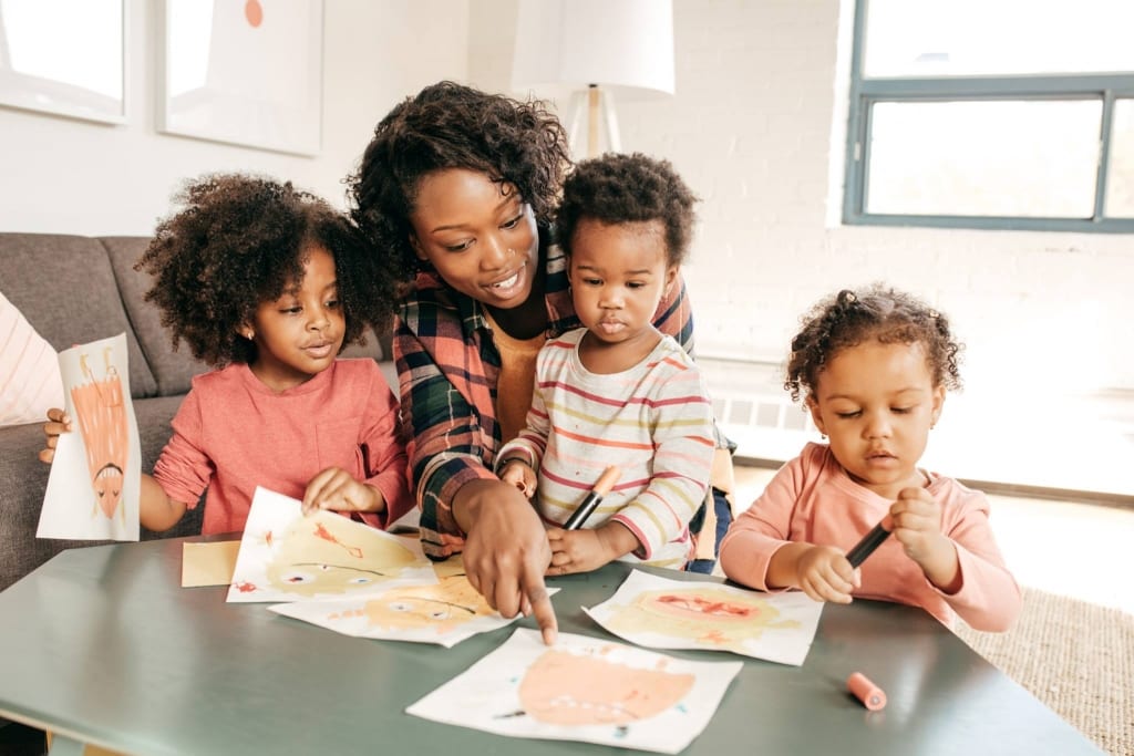 Woman with kids at a table