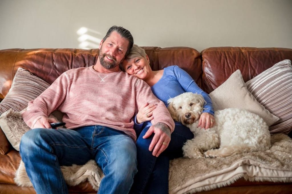 Man and woman on sofa