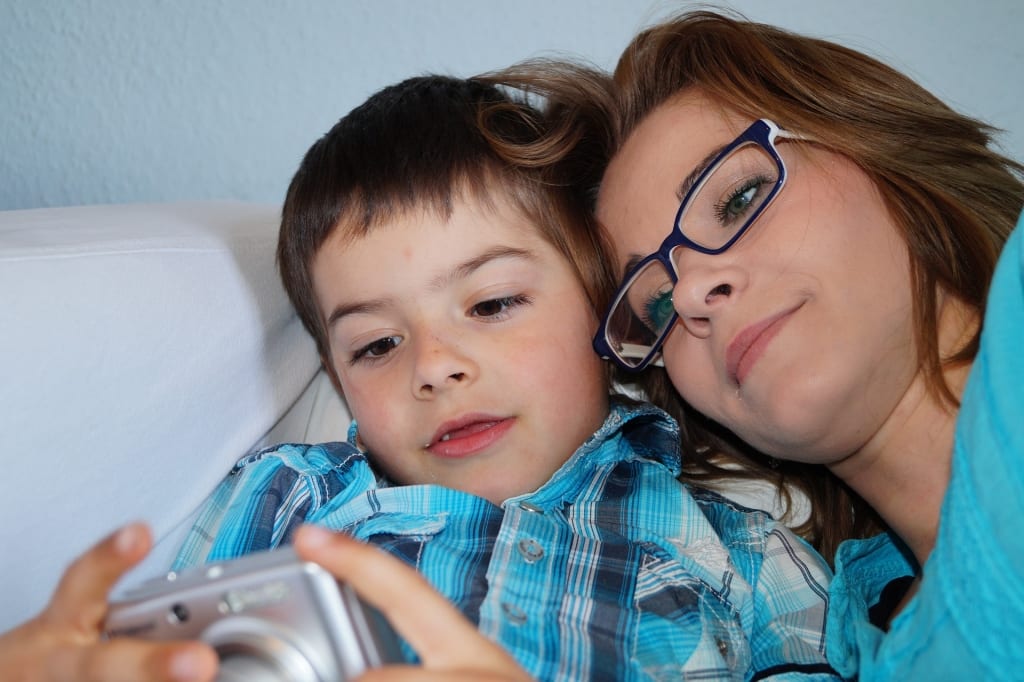 Boy and Woman looking at camera