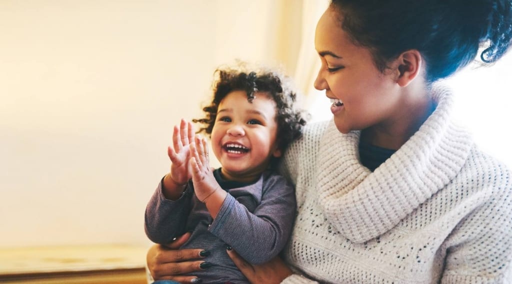 Woman holding toddler