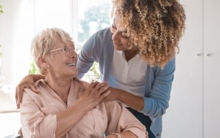 Elderly woman with aide